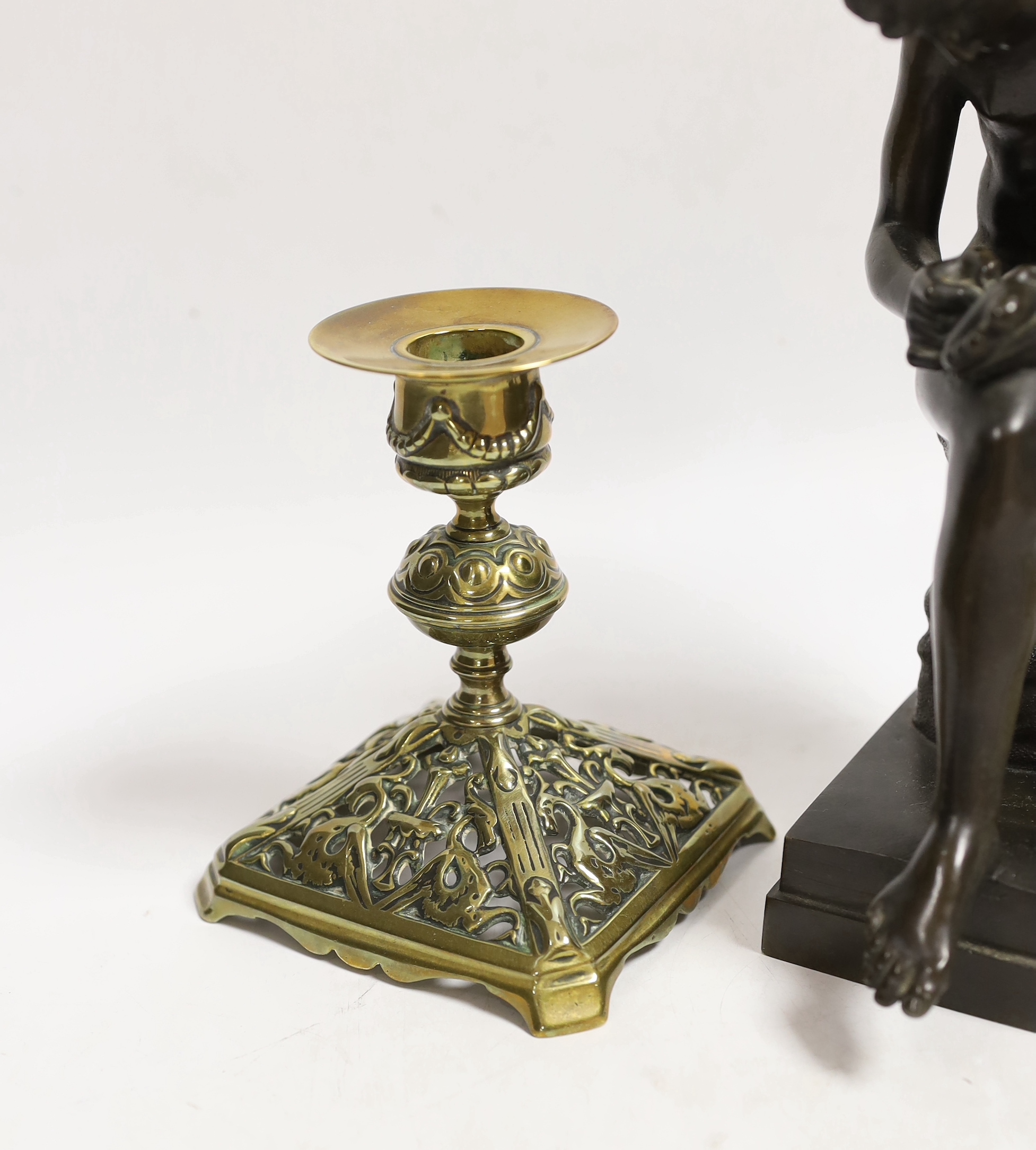 A bronze model of Spinario and a pair of Victorian dwarf candlesticks, lozenge mark to base, tallest 21cm